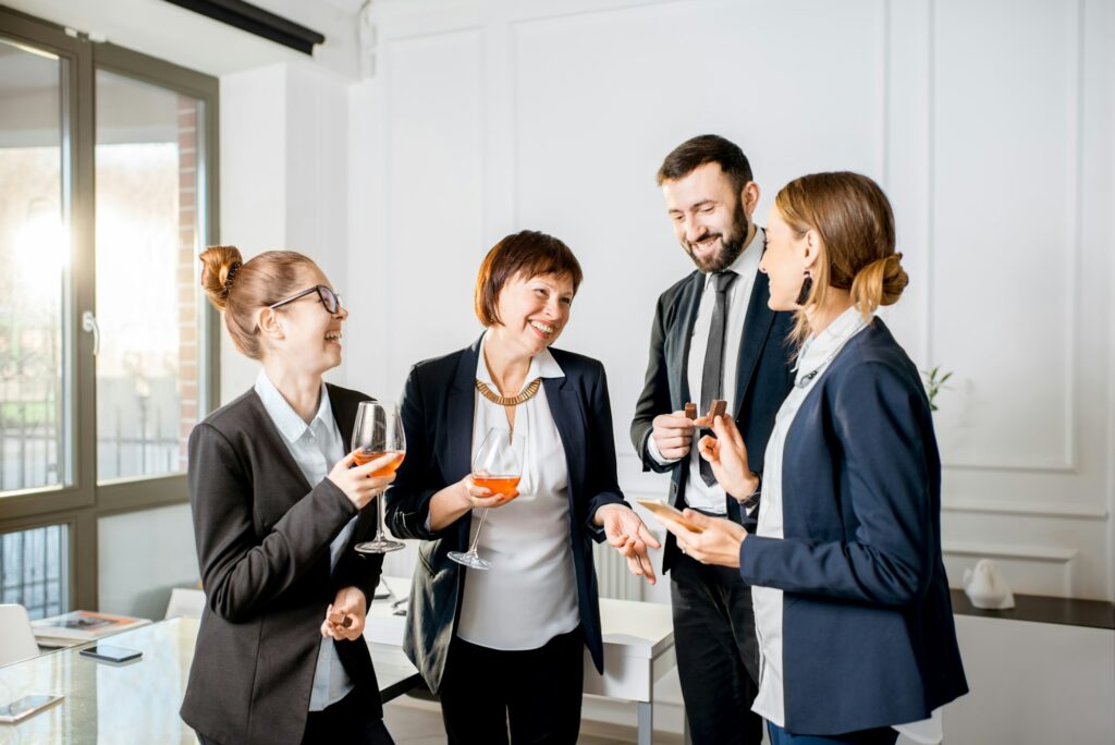 A group of people standing around each other.